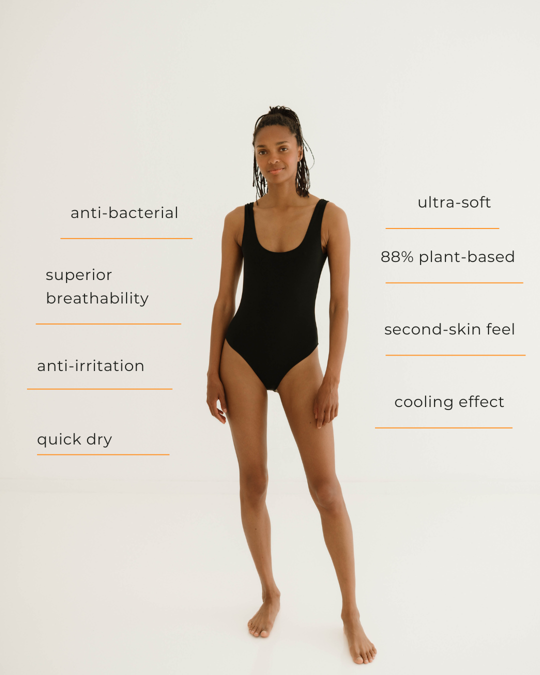 Woman wearing black Saade sauna swimsuit